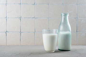 Glass and bottle of milk on the kitchen table
