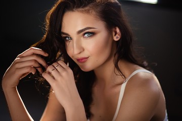 Obraz premium brunette girl with curly hair/advertising