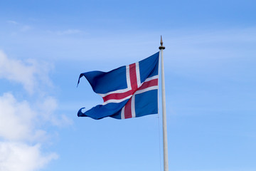 Iceland flag that waves over blue sky