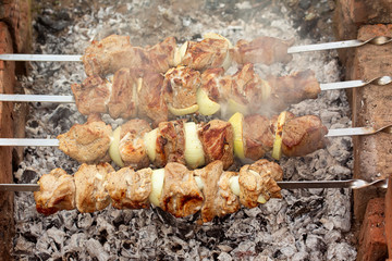 Barbecue over charcoal fire. Meat food background. Grilled food. Beef steak. Bbq restaurant. Summer background. Fire charcoal.