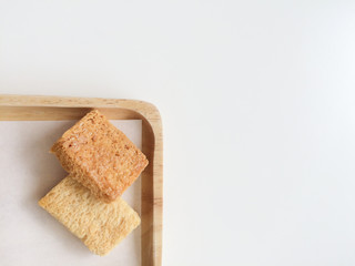 Fototapeta na wymiar Crispy Bread Butter Sugar on wooden tray.