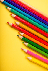 Education. The pencil on the yellow background