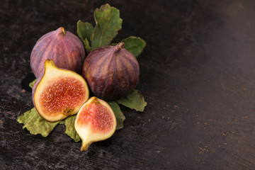 Fresh figs on black background close up