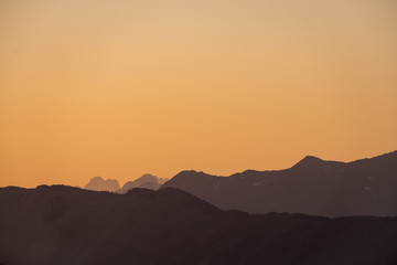 Obraz premium Sunset over mountains Mangart, Kanin in Julian Alps in spring