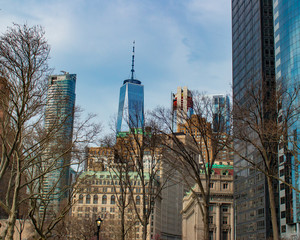 View of One World Trade Center against blue sky from Battery Park, New York