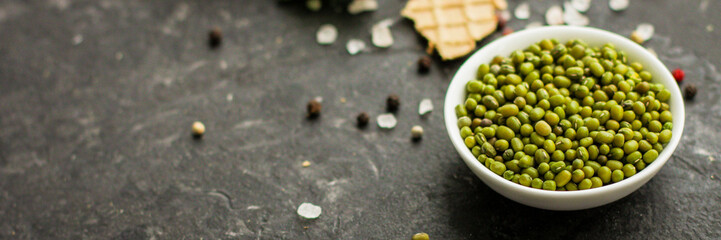 mung beans, mash. green beans in a white plate on the table. top food background. copy space