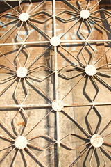 Forged metal figured lattices on the windows, unusual shape, solar lantern.