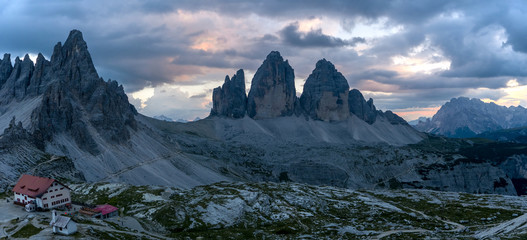 Beautiful wide panoramic image of dramatic dolomite mountain scenery, Tre Cime, Italy