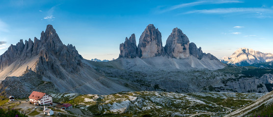 Extra wide panorama of dolomite mountain scenery at sunset, Tre Cime, Italy