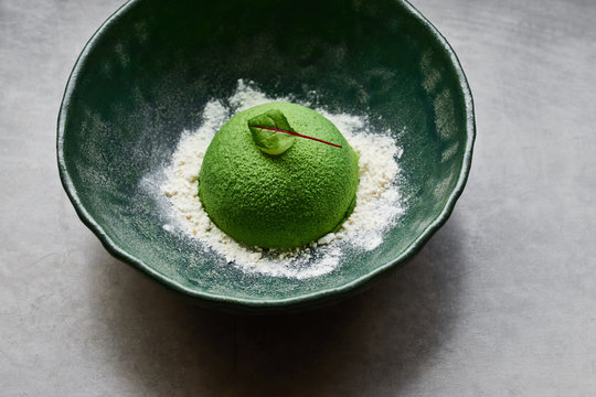 Dessert in the form of a hemisphere. Gourmet dish. Modern nordic cuisine.