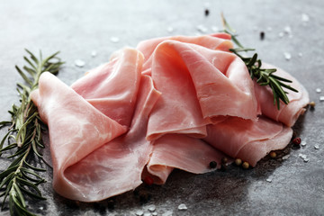 Sliced ham on wooden background. Fresh prosciutto cotto. Pork ham sliced.