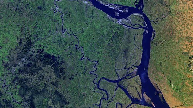 Aerial satellite view of riverbed in green land, water resource and transport route, Padma river in Bangladesh sunrise animation. Contains public domain image by Nasa