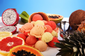 Obraz na płótnie Canvas Tropical fruits background, many colorful ripe fresh tropical fruits