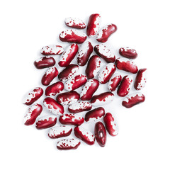 Pile of ripe speckled kidney Anasazi beans, with vivid burgundy color isolated on white background. Close-up.