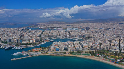 Aerial drone panoramic photo of iconic port of Marina Zeas or Pasalimani with yachts and sail boats docked and beautiful blue sky - clouds, port of Piraeus, Attica, Greece