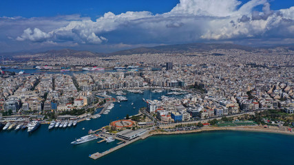 Fototapeta premium Aerial drone panoramic photo of iconic port of Marina Zeas or Pasalimani with yachts and sail boats docked and beautiful blue sky - clouds, port of Piraeus, Attica, Greece