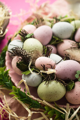 Obraz na płótnie Canvas Easter eggs wreath and decorations on the table, spring