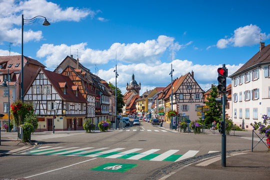 Street with beautiful half-timbered houses in the historic center of Selestat in Alsace.