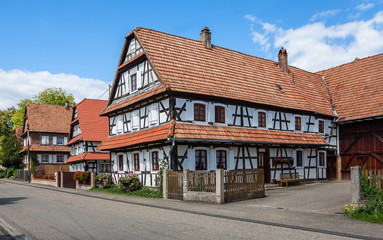 Traditional half-timbered houses in the streets of the small town of Hunspach in Alsace