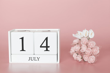 July 14th. Day 14 of month. Calendar cube on modern pink background, concept of bussines and an importent event.