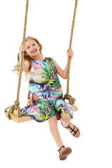 Little girl swinging on a swing