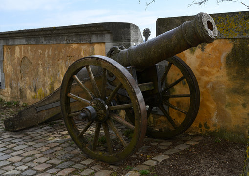 historical military cannon at a castle wall