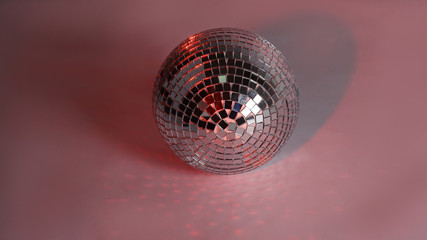 beautiful disco ball on yellow background isolated.