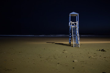 Beach watchtower on the beach of Essaouira illuminated at night