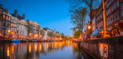 Fototapeta na wymiar Blurred night panorama of Amsterdam, Netherlands.