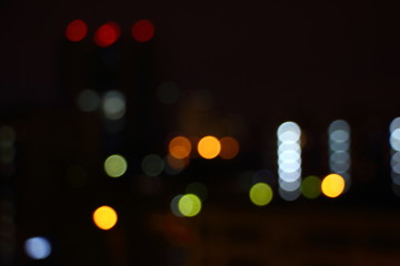 Colored blurred night city street lights - texture for background