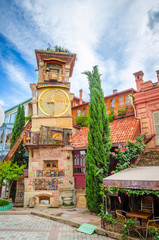 Fototapeta premium Beautiful Clock Tower of puppet theater Rezo Gabriadze in historical center of old Tbilisi, Georgia