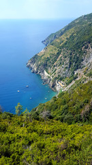 Beautiful Panoramic view of Cinque Terre national park, Liguria, Italy. These are the five famous colorful fisherman villages, suspended between sea and land on sheer cliffs.