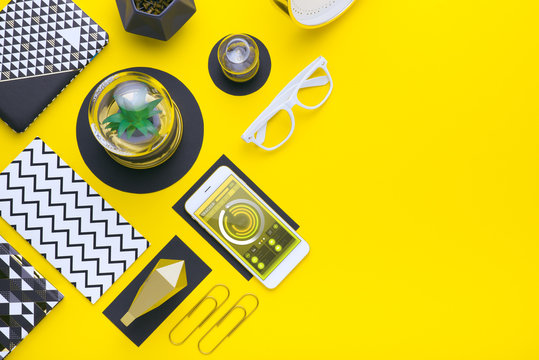 Man holds a tablet and looks at the screen. Mobile development. Innovational online businesses. Internet technologies. Trendy design. Geometry. Fashionable vibrant colors. Using a device. UX and UI.