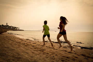Two kids running together at morning exersises, sepia toned