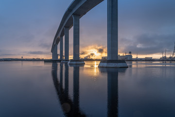 The massive Jordan Bridge over the Elizabeth River in Virginia, reflecting in the water at sunset, in high resolution