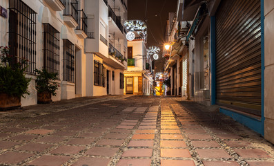 Fototapeta na wymiar Empty night street of Marbella town, Andalusia, Spain