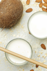 Assortment of organic vegan non-dairy plant-based milk in glasses, top view