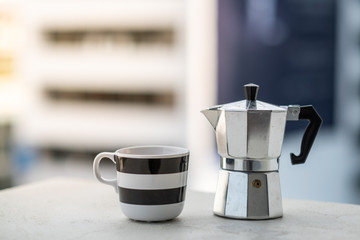 Mokapot and coffee cup