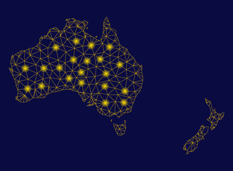 Bright yellow mesh Australia and New Zealand map with glow effect. Wire frame triangular mesh in vector EPS10 format on a dark black background. Abstract 2d mesh designed with triangular lines,