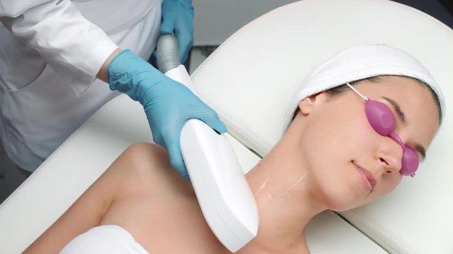 Medium shot of laser rejuvenation procedure, neck area