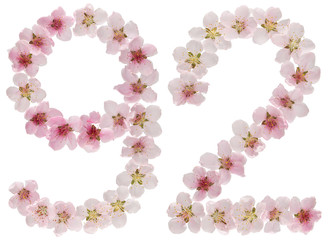 Numeral 92, ninety two, from natural pink flowers of peach tree, isolated on white background