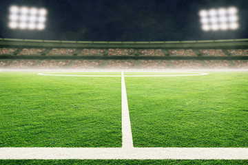 Fototapeta premium Low Angle View of Soccer Field With Stadium Lights and Copy Space