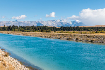 Tekapo canal in Mackenzie Country with Southern Alps in background, South Island, New Zealand