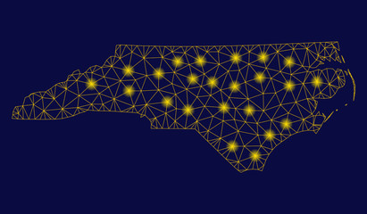 Bright yellow mesh North Carolina State map with lightspot effect. Wire frame polygonal mesh in vector EPS10 format on a dark black background. Abstract 2d mesh designed with polygonal grid, dots, © Tensor Designs