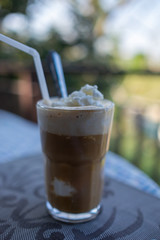 cup of coconut coffee with on wooden background