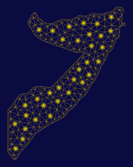 Bright yellow mesh Somalia map with glare effect. Wire frame polygonal network in vector EPS10 format on a dark black background. Abstract 2d mesh designed with polygonal grid, dots,