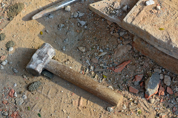 Closeup of sledgehammer on construction site