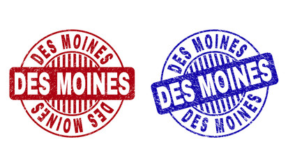 Grunge DES MOINES round stamp seals isolated on a white background. Round seals with grunge texture in red and blue colors. Vector rubber watermark of DES MOINES tag inside circle form with stripes.