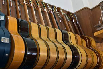 Wooden acoustic guitars for sale in a music shop, Granada , Spain