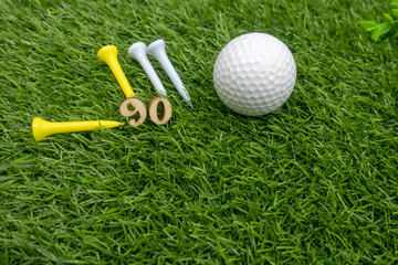 90th birthday to golfer with golf ball and tee on green grass